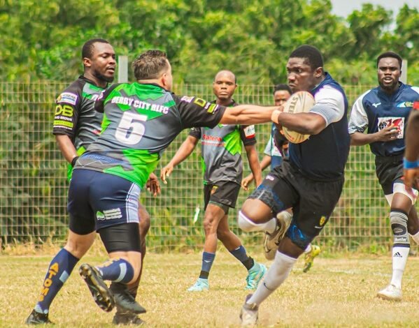 Panthers William Asilevi (with ball) invades a tackle from Abdulrahman Moussa of Dragons