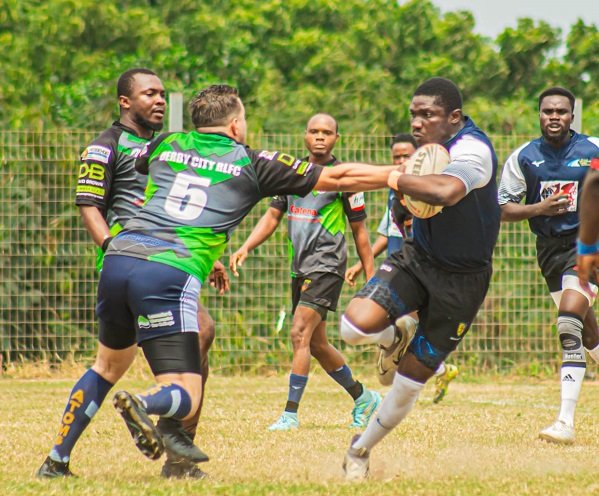 Panthers William Asilevi (with ball) invades a tackle from Abdulrahman Moussa of Dragons