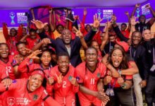 Players and officals of Malawi celebrating their historic qualification