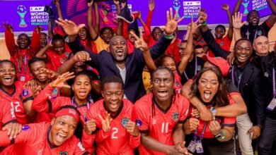 Players and officals of Malawi celebrating their historic qualification