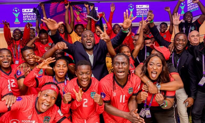 Players and officals of Malawi celebrating their historic qualification