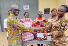Evan Boakye (left) presenting the items to Sgt Saaba