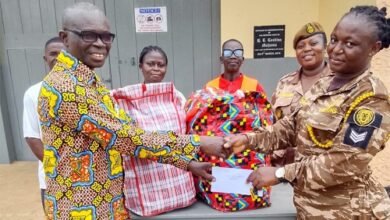 Evan Boakye (left) presenting the items to Sgt Saaba