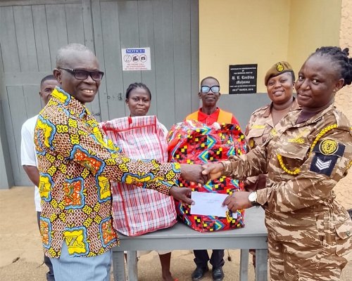 Evan Boakye (left) presenting the items to Sgt Saaba