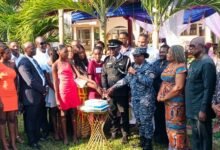 ACP Antwi-Ababio (middle) together with other guests cutting the send - off cake