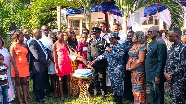 ACP Antwi-Ababio (middle) together with other guests cutting the send - off cake