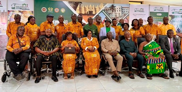 Mrs Houadjeto (seated middle) with Mr Abraham Amaliba (seated third from right) and other stakeholders after the launch