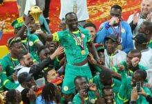 Sadio Mané leads the Senegalese celebrations after receiving the trophy