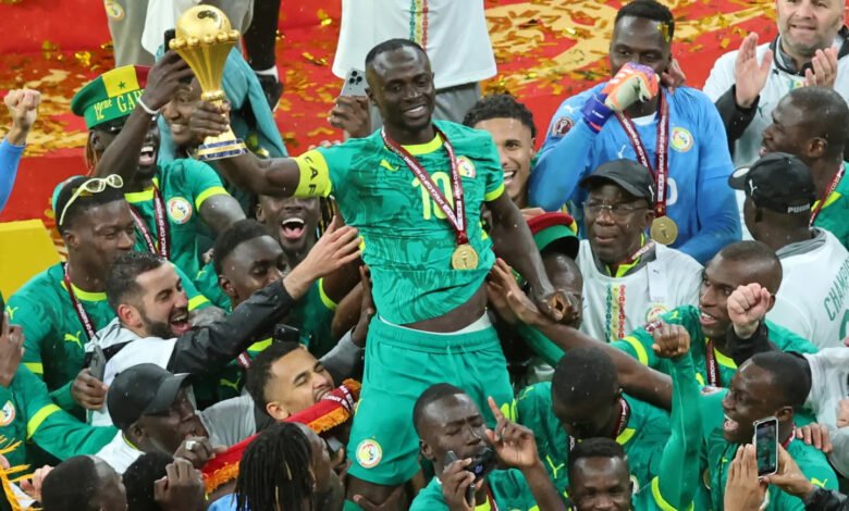Sadio Mané leads the Senegalese celebrations after receiving the trophy