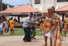 Mrs Baffour-Agyei (in kente) dancing at the event