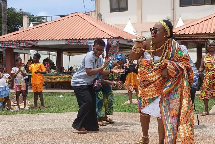 Mrs Baffour-Agyei (in kente) dancing at the event