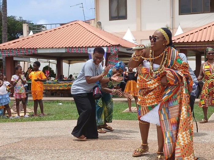 Mrs Baffour-Agyei (in kente) dancing at the event
