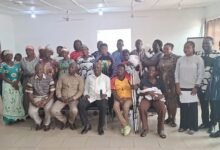 -Mr Nabwomya with participants after the meeting