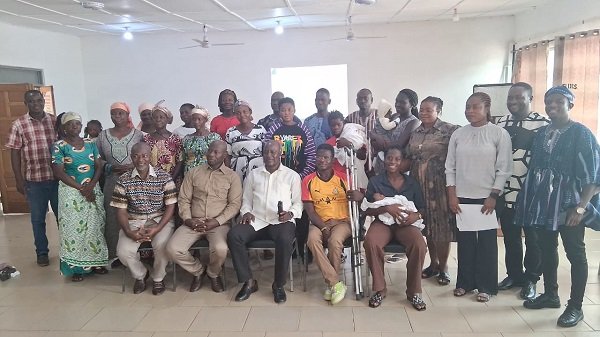 -Mr Nabwomya with participants after the meeting
