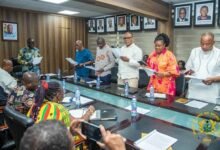 Mr Armah-Kofi Buah (head of table) swearing in members at the inauguration