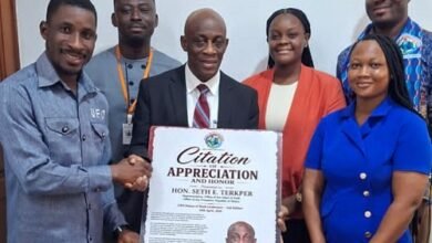 Mr Seth Terkper (middle) receiveing a citation of appreciation and honour from UFO officials