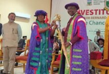 Professor Alabi (middle) presenting the UMaT ceremonial mace to Professor Kumi-Boateng during the ceremony