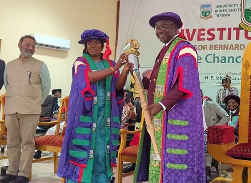Professor Alabi (middle) presenting the UMaT ceremonial mace to Professor Kumi-Boateng during the ceremony