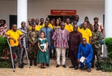 Prof. Alhassan (middle, in smock) with workers and dignitaries after the launch
