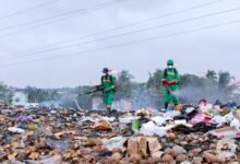 Workers of Zoomlion carrying out a disinfection exercise at Accra Newtown.