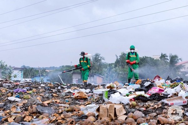 Workers of Zoomlion carrying out a disinfection exercise at Accra Newtown.
