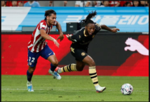 Antoine Semenyo in action with Atletico Madrid's Carlos Martin