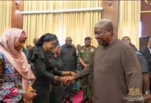 President Mahama (right) exchanging greetings with victims' relatives at Jubilee House