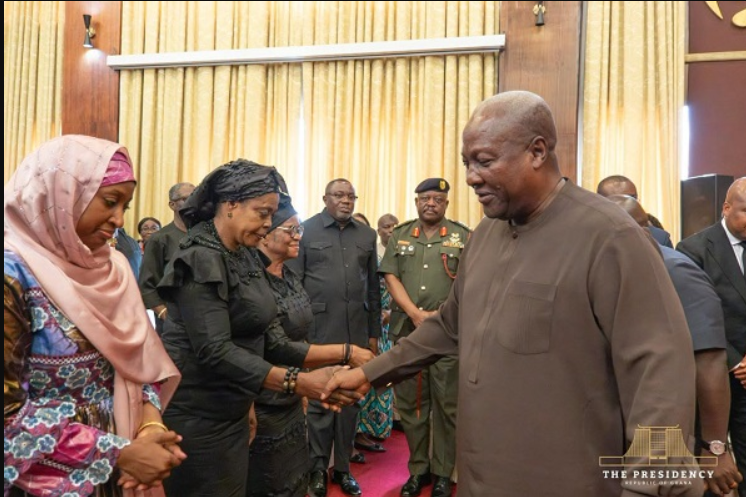 President Mahama (right) exchanging greetings with victims' relatives at Jubilee House