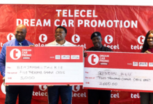 Accra-based winners, Benjamin Tackie and Gideon Klu (middle), receive their monthly cash rewards in the Telecel Dream Car Promo
