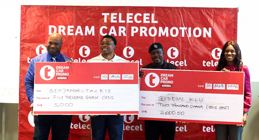 Accra-based winners, Benjamin Tackie and Gideon Klu (middle), receive their monthly cash rewards in the Telecel Dream Car Promo