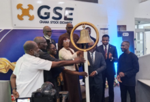 Ms Pearl Nkrumah (fourth from left) with Ms Amoah (third from left) and others tolling the GSE bell to mark the listing of PETROSOL Platinum Energies PLC on the Accra bourse