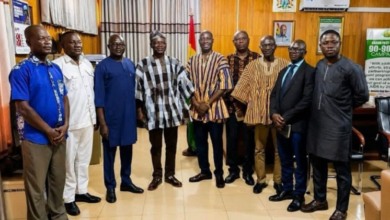 Mr Mburidiba (fourth from left) with the management of GSS after the visit