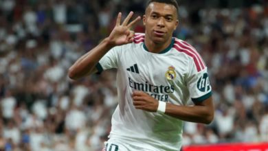 Kylian Mbappe celebrates scoring a hat-trick and his team's fourth goal