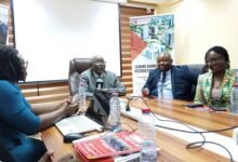 Mr Addo (head of table) addressing the media