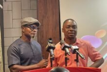 Rev. Agyapong (left) speaking at the programme. With him is Mr Agbo