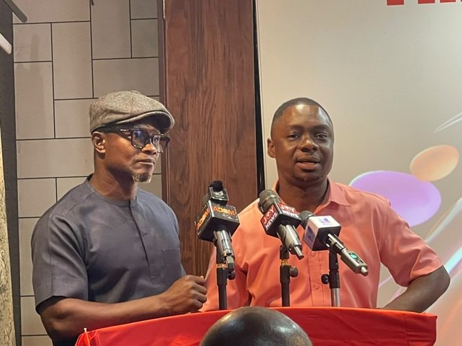 Rev. Agyapong (left) speaking at the programme. With him is Mr Agbo