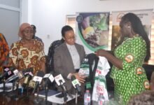 Prof. Klutse (right) presenting printed T-Shirts to Dr Agyemang-Rawlings during the visit Photo Victor A. Buxton