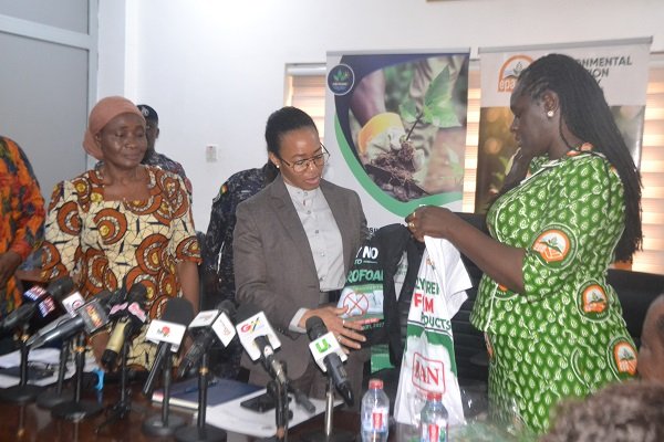 Prof. Klutse (right) presenting printed T-Shirts to Dr Agyemang-Rawlings during the visit Photo Victor A. Buxton