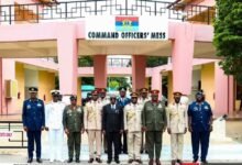 The eight retiring officers and some dignitaries at the pregramme