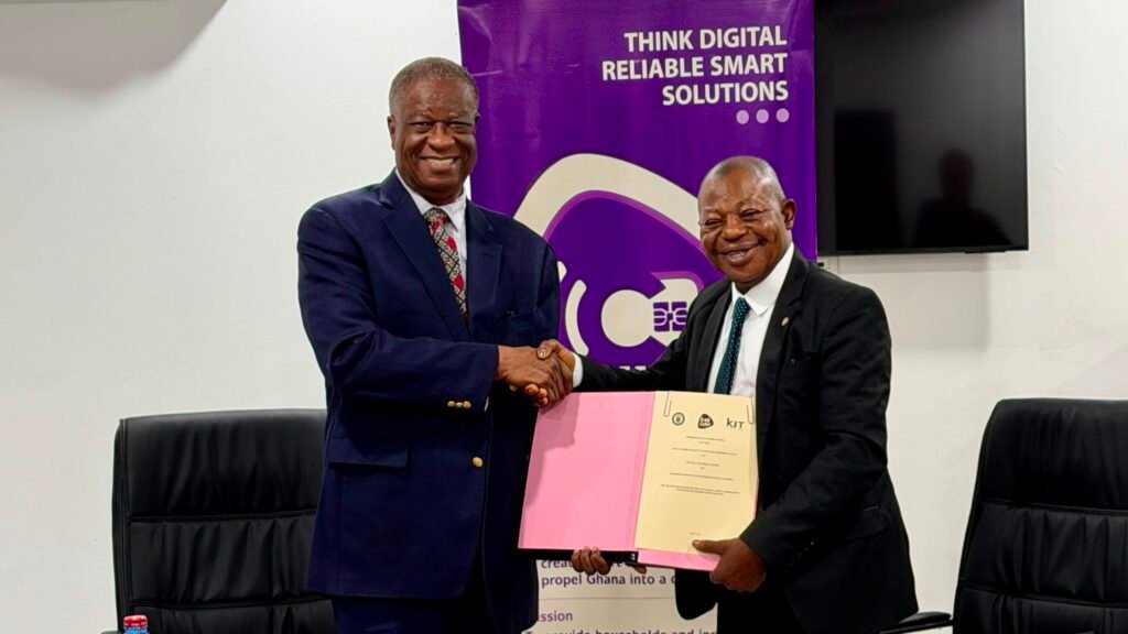 Professor Malcalm (right) and Dr Kludjeson displaying the signed MOU