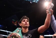 Garcia displays title and acknowledges cheers from the fans after he was declared the winner
