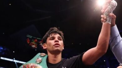 Garcia displays title and acknowledges cheers from the fans after he was declared the winner