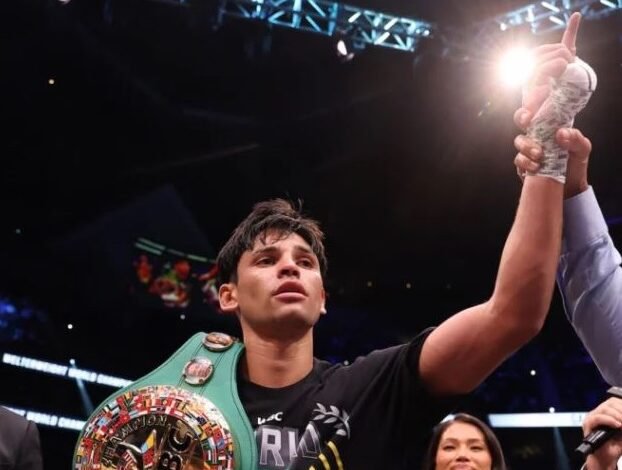 Garcia displays title and acknowledges cheers from the fans after he was declared the winner