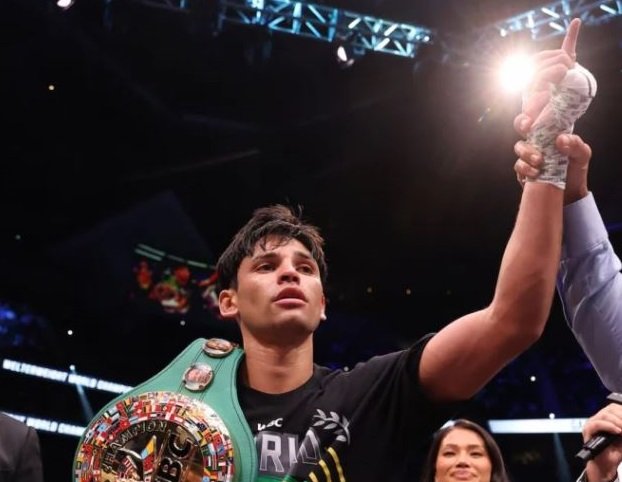 Garcia displays title and acknowledges cheers from the fans after he was declared the winner