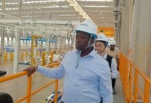 Mr Armah-Kofi Buah touring the showroom of EVs in China