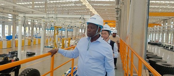 Mr Armah-Kofi Buah touring the showroom of EVs in China