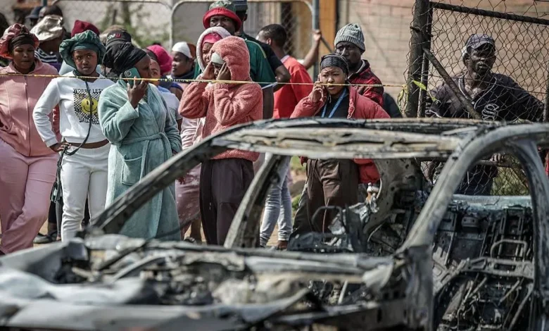 Gunmen torched vehicles as they fled the scene of a mass shooting at bar near Johannesburg