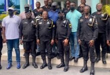 Mr Christian TettehYohuno (middle) with some members of the police management baord and the promoted officers