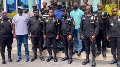 Mr Christian TettehYohuno (middle) with some members of the police management baord and the promoted officers