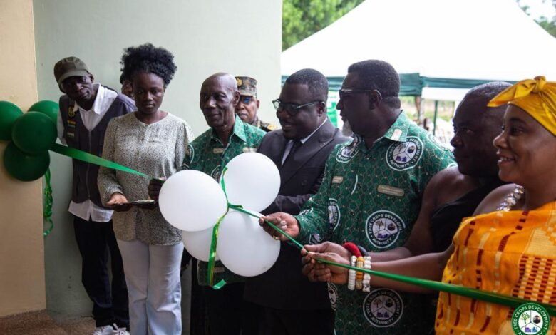 Dr. Andy Osei (third from right) with Mr. Akwaboah (third from left) and other dignitaries cutting the tape to officially open the new regional CDA office in Sunyani